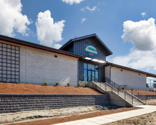 Hillcrest Ace Hardware Medford side elevation with retaining wall and stair access