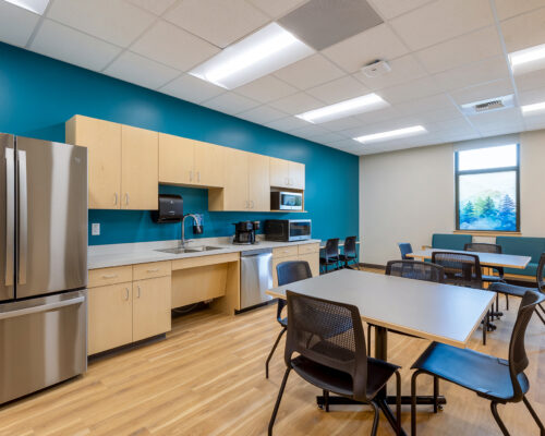 Staff breakroom and kitchenette with seating area at SOESD Phoenix campus