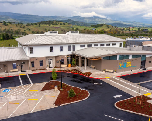 Front entrance of SOESD Phoenix campus with covered entry and surrounding landscape