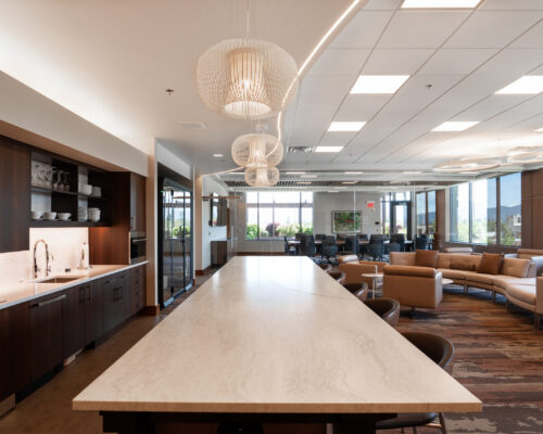 Kitchen with built-in espresso station and large island in the Sellwood Ventures office suite